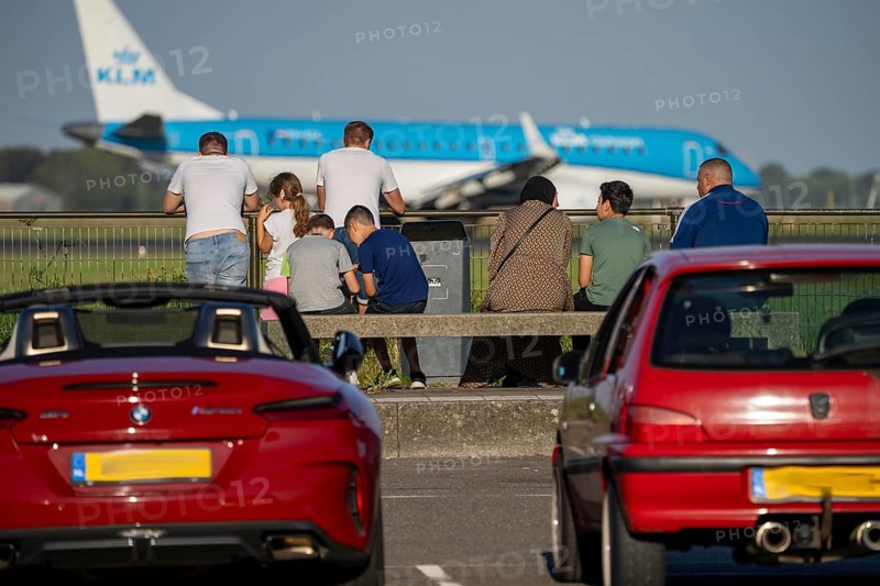 KLM aircraft after landing at Amsterdam Schiphol Airport, Polderbaan, 18R/36L, spotter spot, spectators at the runway, Netherlands