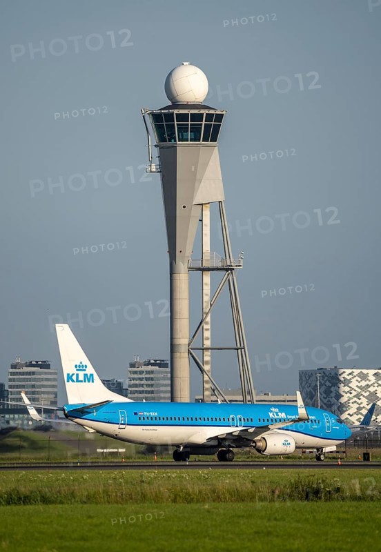 KLM aircraft after landing at Amsterdam Schiphol Airport, Polderbaan, 18R/36L, taxiway to terminal, Schiphol West control tower and radar tower, Netherlands