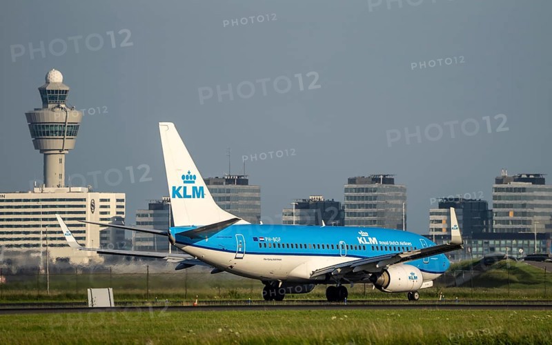 KLM aircraft after landing at Amsterdam Schiphol Airport, Polderbaan, 18R/36L, taxiway to the terminal, Schiphol Centre air traffic control tower, terminal building and radar tower, Netherlands