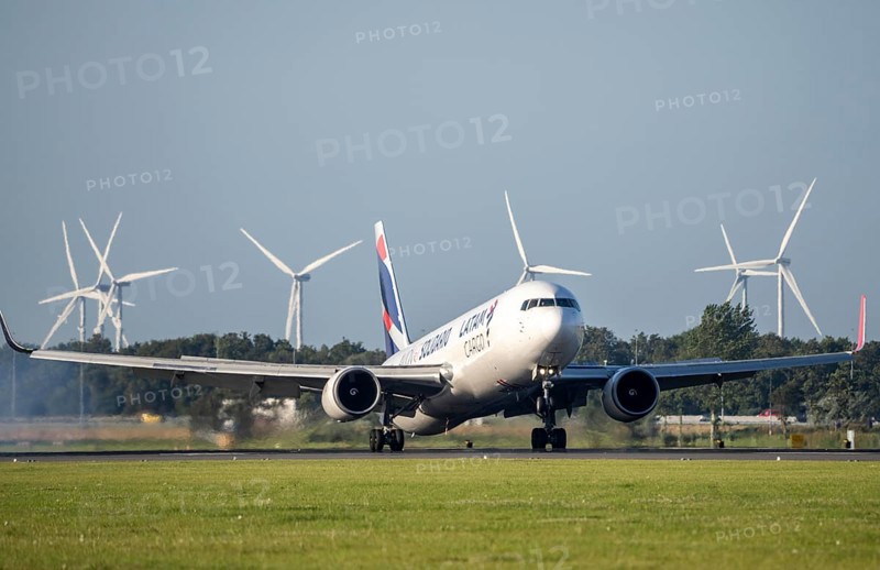 LATAM Cargo, Columbia, aircraft landing at Amsterdam Schiphol Airport, Polderbaan, 18R/36L, wind farm in the background, Netherlands