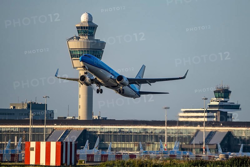 KLM aircraft taking off from Amsterdam Schiphol Airport, Kaagbaan, 06/24, air traffic control tower, terminal, Netherlands