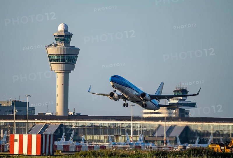 KLM aircraft taking off from Amsterdam Schiphol Airport, Kaagbaan, 06/24, air traffic control tower, terminal, Netherlands