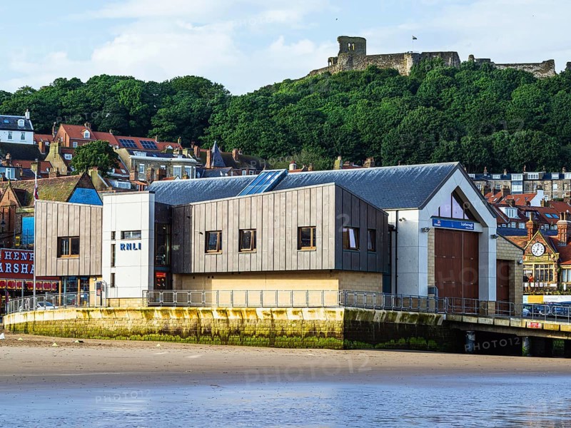 RNLI Scarborough Lifeboat Station and boat over Scarborough Beach, Scarborough, North Yorkshire, England, United Kingdom, Europe