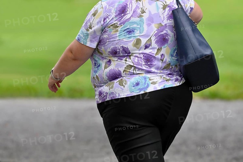 Symbol photo woman with overweight