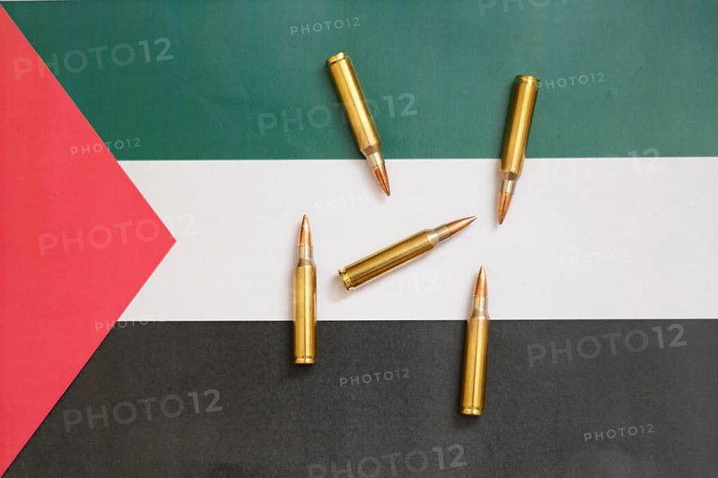 Palestinian flag with cartridges, Middle East conflict
