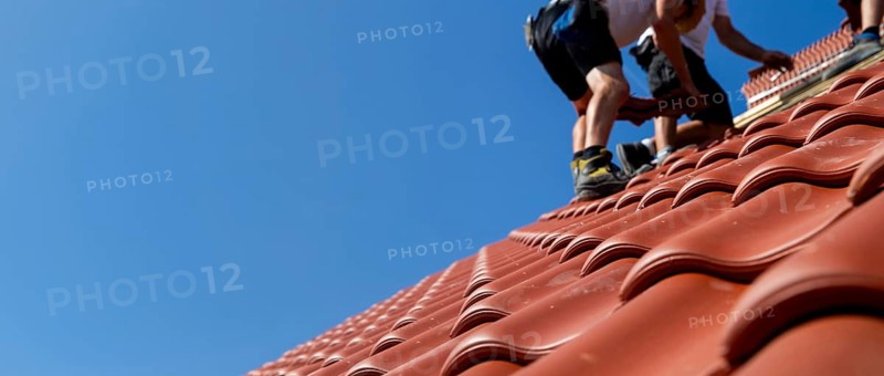 Panoramic image of the roof covering of a new tiled roof on a residential building