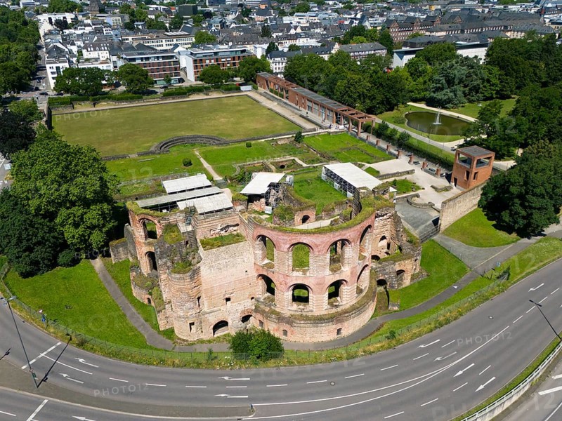 Aerial view of historical ruins in a city, surrounded by streets and a green park, aerial view, Imperial Baths, Trier, Rhineland-Palatinate, Germany, Europe