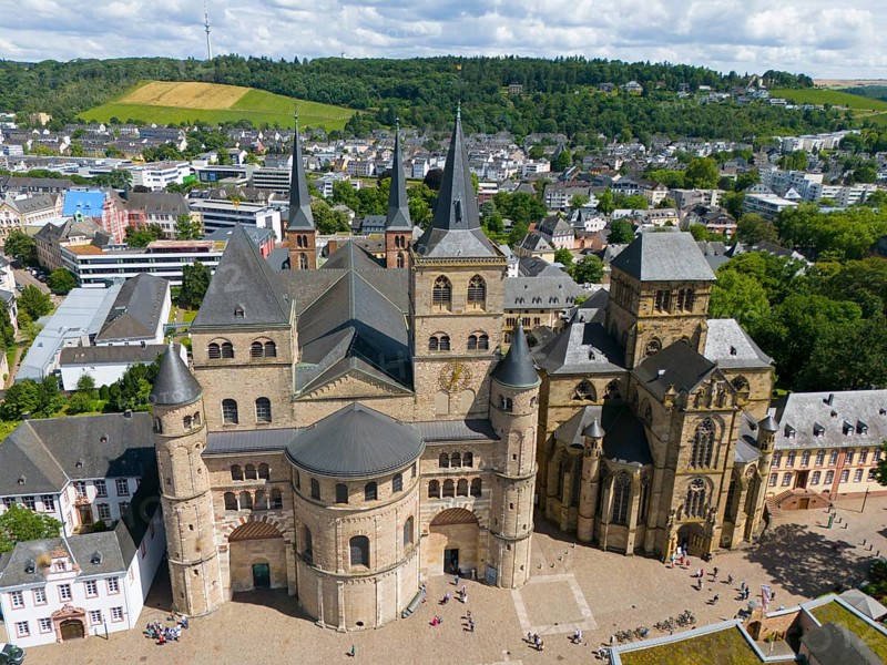 Historic cathedral with towers, surrounded by cityscape and hills under blue sky in Trier, aerial view, Trier Cathedral, Episcopal Church, Trier, Rhineland-Palatinate, Germany, Europe