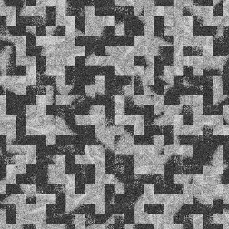 An abstract geometric pattern with black, white, and gray pixelated block shapes creating a textured effect