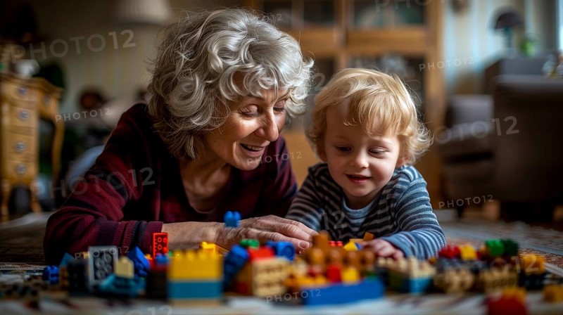 A cheerful grandmother and her grandson playing with building blocks in a warmly lit indoor setting, AI generated