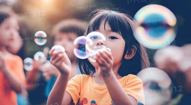 A young asian girl is blowing bubbles in a park and enjoys family activity on the weekend, AI generated