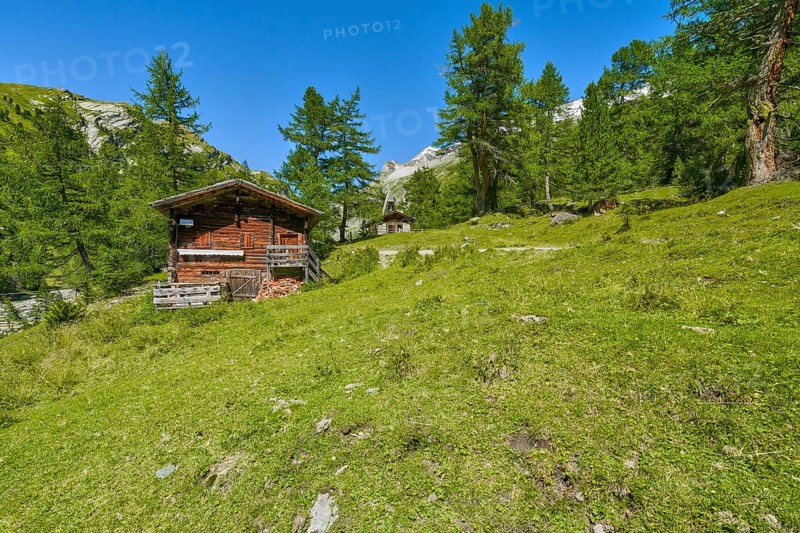 Alpine hut with chapel in the Kalser Tauern, blue sky, snow-covered mountains, Dorfertal, Hohe Tauern National Park, Kals am Grossglockner, East Tyrol