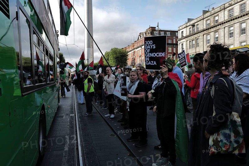 Dublin, Ireland. A Dublin bus passes close to protesters during a pro-Palestine protest in O'Connell Street