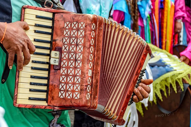 Accordionist playing during an important and traditional religious festival in the streets of Belo Horizonte, Brazil, Belo Horizonte, Minas Gerais, Brazil, South America