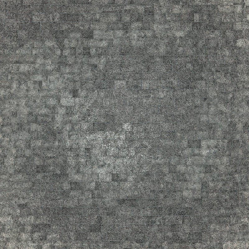 An abstract gray mosaic pattern consisting of numerous small square tiles creating a textured surface