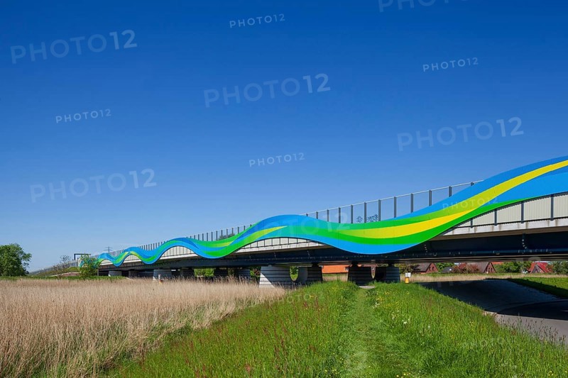 Colourfully painted motorway bridge with noise barrier over the river Este, Buxtehude, Altes Land, Lower Saxony, Germany, Europe