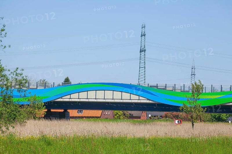 Colourfully painted motorway bridge with noise barrier over the river Este, Buxtehude, Altes Land, Lower Saxony, Germany, Europe