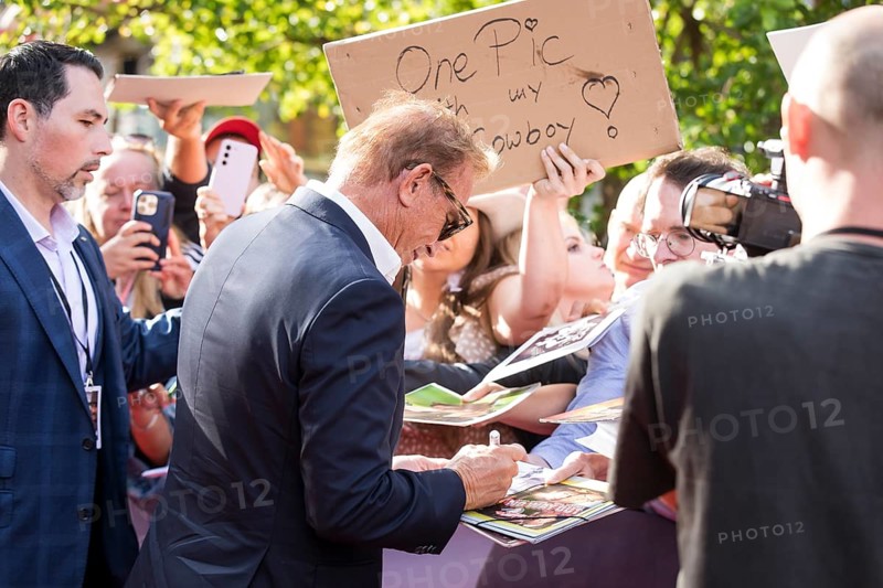 Kevin Costner signs autographs at the premiere of Horizon at Berlin's Zoo Palast on 04/08/2024