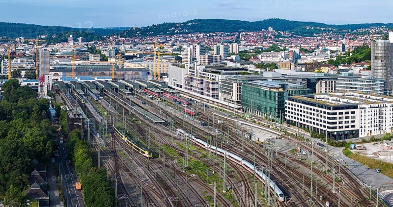 Track apron at the main station with ICE and regional train. After completion of the Stuttgart 21 project, the new Rosenstein neighbourhood and flats are to be built here. But the plan is faltering. Firstly, the connection of the Gäubahn railway to the new through station is unclear. Secondly, an amendment to the General Railway Act (AEG) could prevent the track system from being cancelled. Aerial view. Panoramic photo. Stuttgart, Baden-Württemberg, Germany, Europe