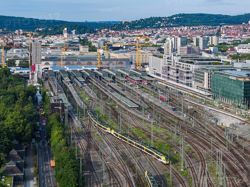 Track apron at the main railway station with a regional train. After completion of the Stuttgart 21 railway project, the new Rosenstein district and flats are to be built here. But the plan is faltering. Firstly, the connection of the Gäubahn railway to the new through station is unclear. Secondly, an amendment to the General Railway Act (AEG) could prevent the track system from being cancelled. Aerial view. Stuttgart, Baden-Württemberg, Germany, Europe