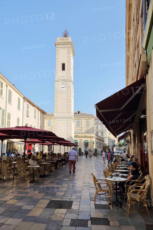Clock tower Tour de l'Horloge and street bar with people, Tower with clock, Place de l'Horloge, Nîmes, Gard, Provence, France, Europe