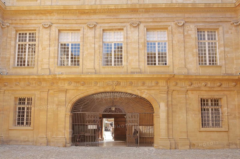 House facade with metal gate and window in the inner courtyard of the town hall, decorations, archway, entrance, Hôtel de Ville, Place de l'Hôtel de Ville, Town Hall Square, Rathausplatz, Aix-en-Provence, Bouches-du-Rhône, Provence, France, Europe