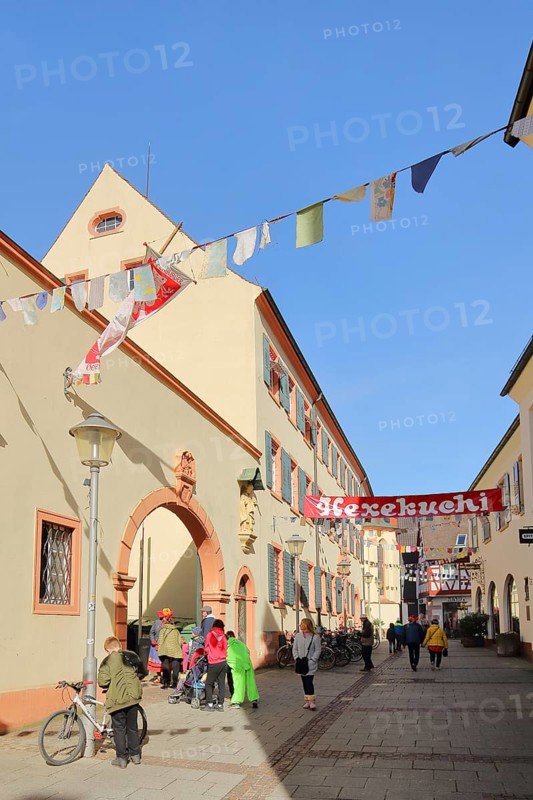 St. Andreas Hospital with banner Hexekuchi for carnival and people, pennant chain, decoration, Spitalstrasse, Offenburg, Ortenau, Baden-Württemberg, Germany, Europe