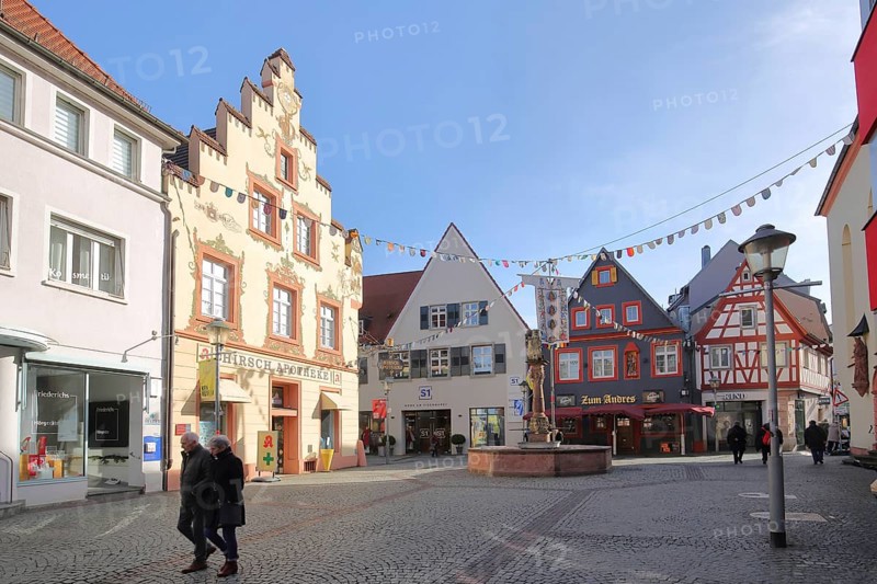 Fish market with historic stag pharmacy with stepped gable and lion fountain with carnival, decoration, pennant chain, stag pharmacy, Offenburg, Ortenau, Northern Black Forest, Black Forest, Baden-Württemberg, Germany, Europe