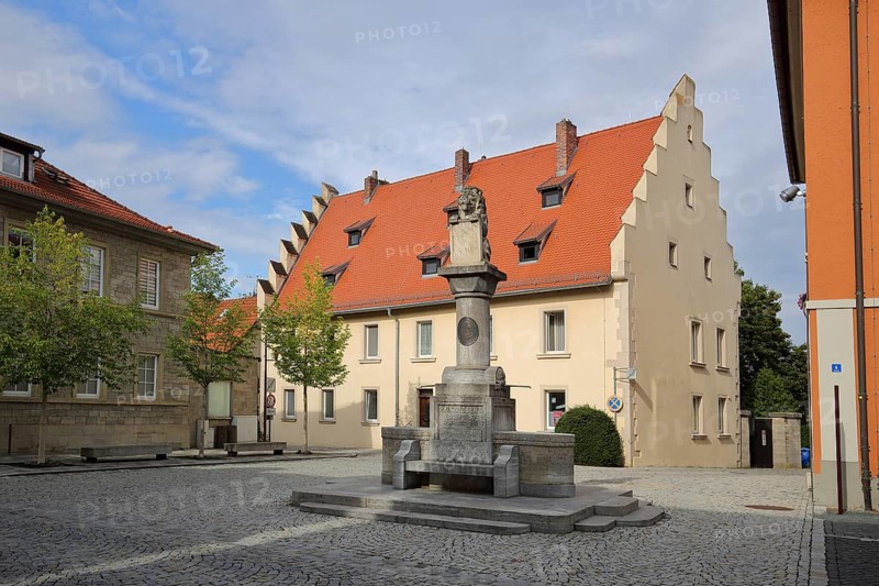 Luitpold fountain and historic building built in the 15th century with stepped gable, Mellrichstadt, Rhön, Lower Franconia, Franconia, Bavaria, Germany, Europe
