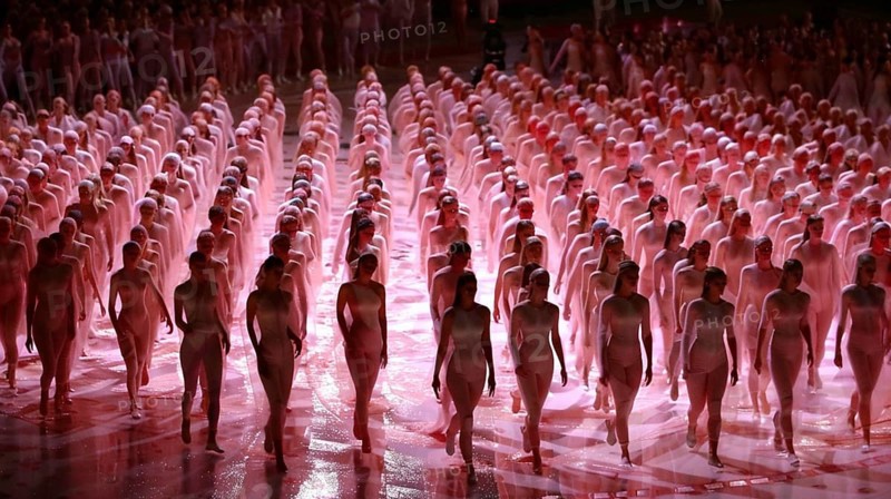 Crowd of performers in red-lit costumes, standing in perfect symmetry at a stadium, AI generated
