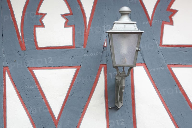 Street lamp on the wall of a half-timbered house, red, grey, frame, border, detail, decoration, König Adolf Platz, Idstein, Taunus, Hesse, Germany, Europe