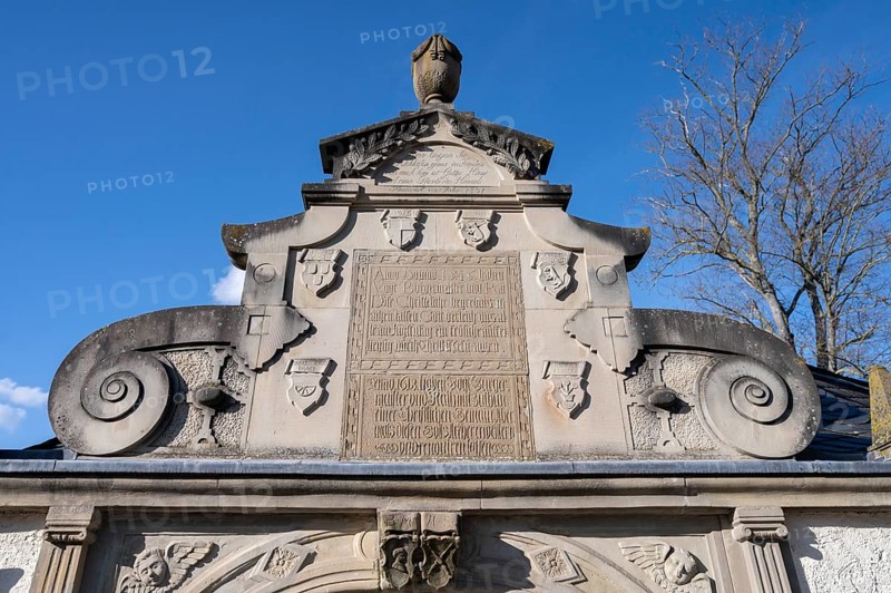 Detail of the entrance portal of the cemetery, since 1618, with volutes and coats of arms of the builders and tree moulding, Mainbernheim, Lower Franconia, Bavaria, Germany, Europe