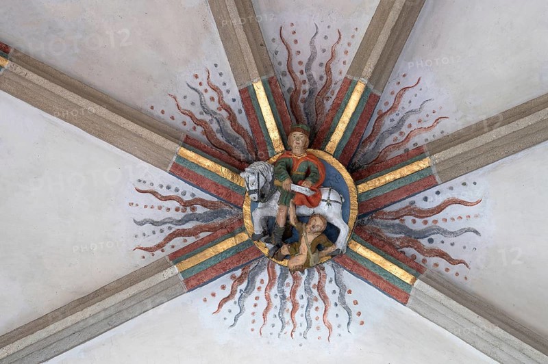 St Martin donating his cloak in Amien, depicted as a bull, keystone in the vault of St Martin's Church, Plieningen, Baden-Württemberg, Germany, Europe