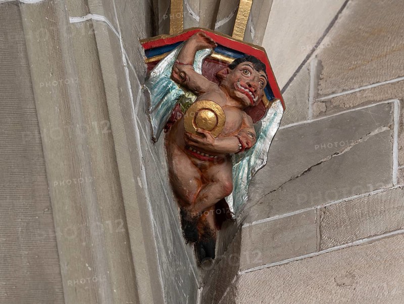Devil with convex mirror, console stone in Heilig Kreuz Minster, Rottweil, Baden-Württemberg, Germany, Europe