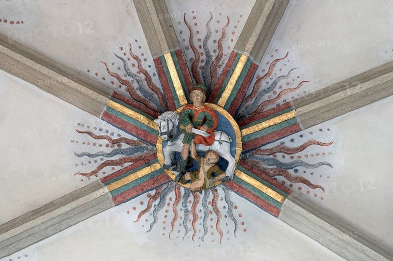 St Martin donating his cloak in Amien, depicted as a bull, keystone in the vault of St Martin's Church, Plieningen, Baden-Württemberg, Germany, Europe
