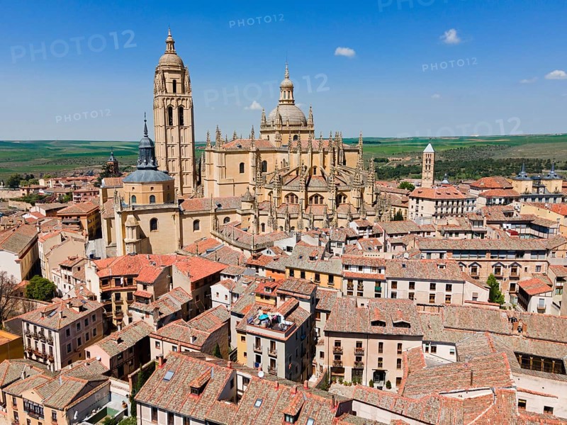 View of a medieval city with a prominent church and historic buildings nestled in a landscape under a clear blue sky, aerial view, Cathedral, Segovia, Castilla y Leon, Leon, Spain, Europe