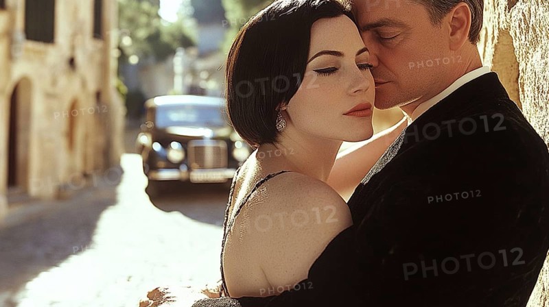 A couple embracing closely on a cobblestone street with a vintage car in the background, AI generated