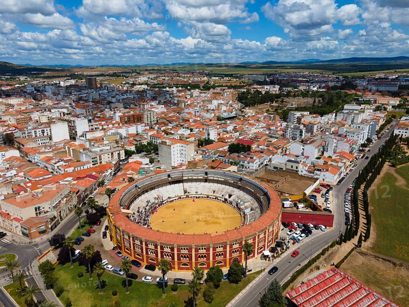 Aerial view of a city with a centrally located bullring under a cloudy sky, aerial view, bullfighting, Merida, Badajoz, Extremadura, Spain, Europe