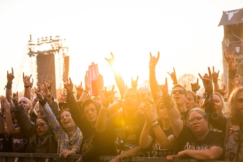 Festival-goers in the front row give the devil's salute at the Wacken Open Air in Wacken. The traditional metal festival takes place from 31 July to 3 August 2024