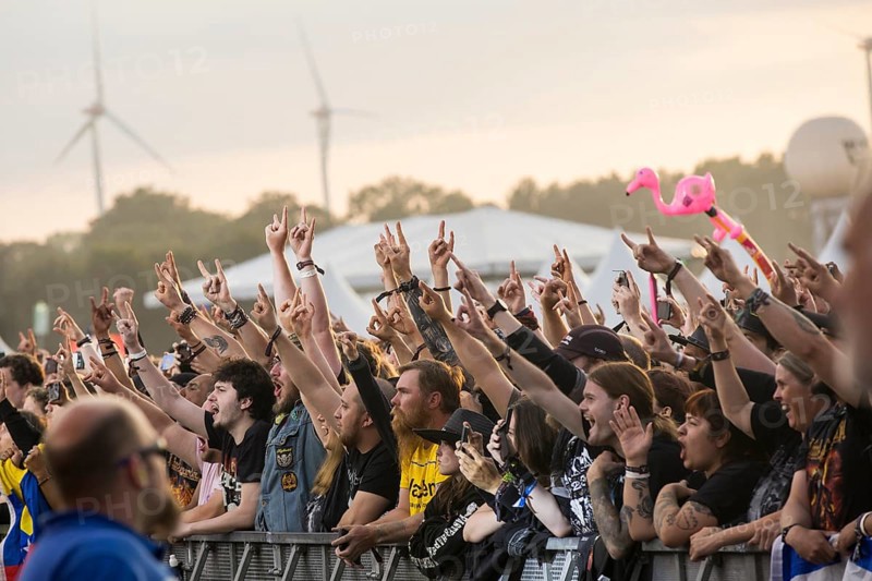 Festival-goers in the front row give the devil's salute at the Wacken Open Air in Wacken. The traditional metal festival takes place from 31 July to 3 August 2024