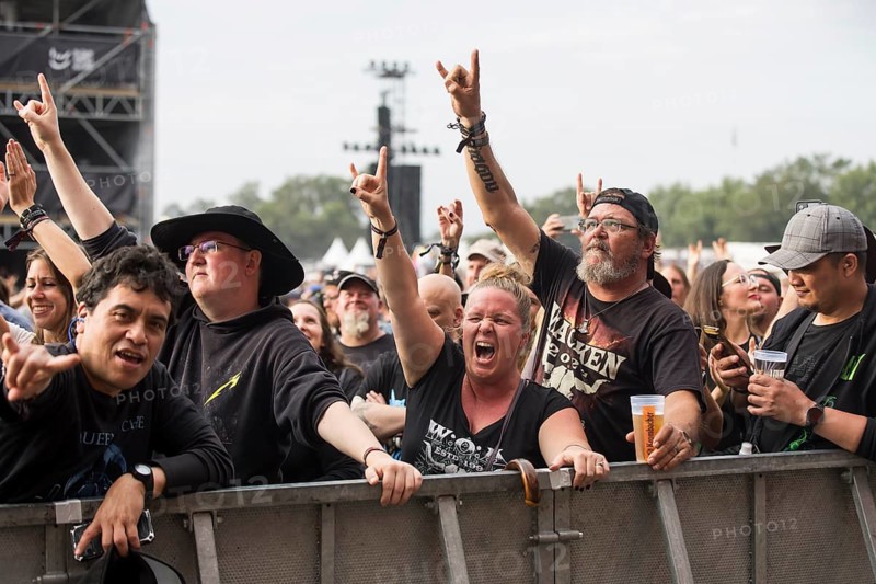 Festival visitors give the devil's salute at the Wacken Open Air in Wacken. The traditional metal festival takes place from 31 July to 3 August 2024