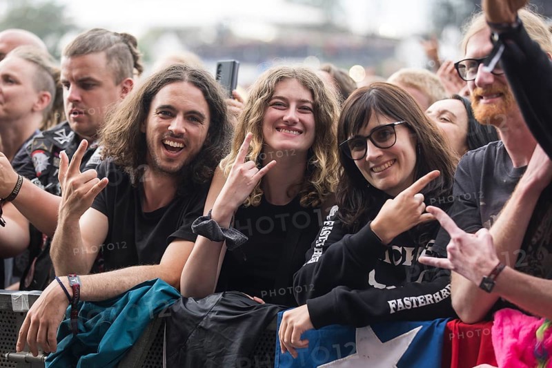 Festival visitors give the devil's salute at the Wacken Open Air in Wacken. The traditional metal festival takes place from 31 July to 3 August 2024