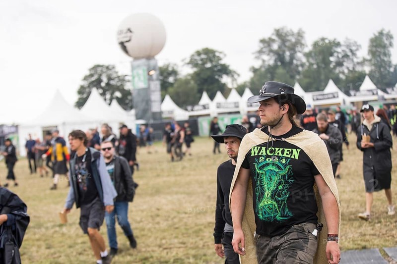 A festival visitor with Wacken shirt and cowboy hat at the Wacken Open Air in Wacken. The traditional metal festival takes place from 31 July to 3 August 2024
