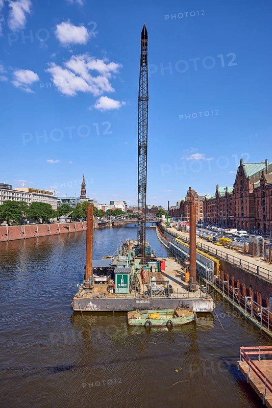 Crane on a pontoon in the inland harbour, construction site at the quay wall and Kehrwieder street, Speicherstadt, Free and Hanseatic City of Hamburg, Hanseatic city, independent city, federal state of Hamburg, Germany, Europe