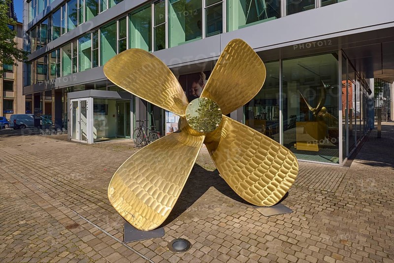 Brass ship's propeller as decoration in front of the Regus office space rental building, Free and Hanseatic City of Hamburg, Hanseatic city, independent city, federal state of Hamburg, Germany, Europe