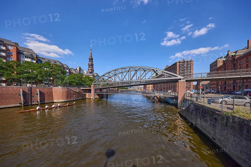 Kibbelsteg bridge over the Zollkanal with canoe and the main church St. Katharinen, Speicherstadt, Free and Hanseatic City of Hamburg, Hanseatic City, independent city, Federal State of Hamburg, Germany, Europe