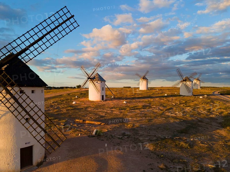 Several windmills in a rural landscape under a slightly cloudy evening sky, aerial view, windmills, Campo de Criptana, Ciudad Real province, Castilla-La Mancha, Route of Don Quixote, Spain, Europe