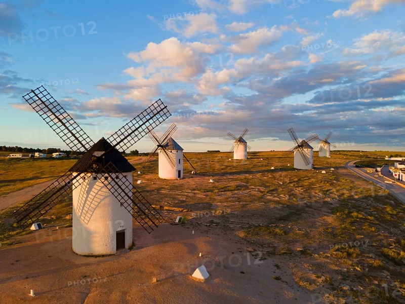 Several windmills are scattered in a wide landscape under a slightly cloudy sky, aerial view, windmills, Campo de Criptana, Ciudad Real province, Castilla-La Mancha, Route of Don Quixote, Spain, Europe