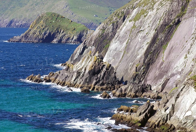Steep cliffs with grassy areas above the rushing sea and rocky shores, Tourism, Slea Head Drive, Dingle, Ireland, Europe