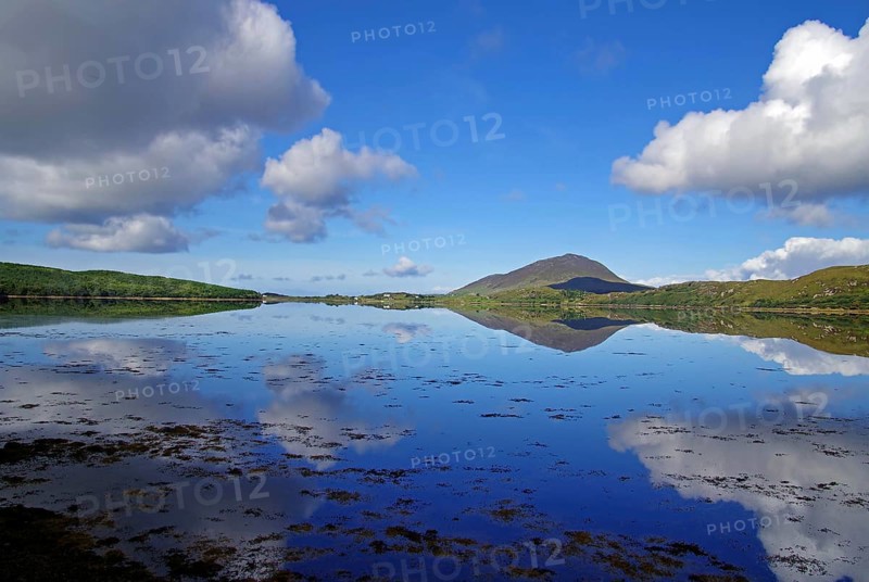 Calm lake with cloud reflections and mountains in the background, Letterfrack, Connemara National Park, Ireland, Europe